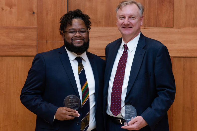 Phillip Lee '14 and Richard Dabrowski '85 with their Alumni Merit Awards.