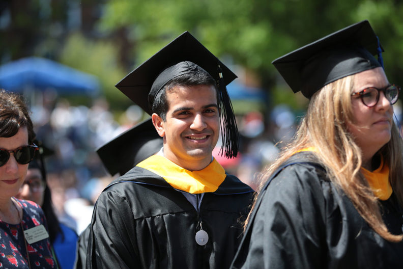 A student waits in line during Elmhurst College's commencement ceremony.
